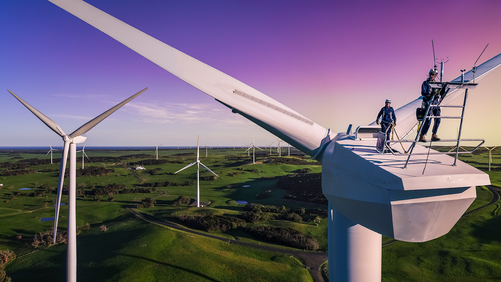 Engineers on top of a wind turbine